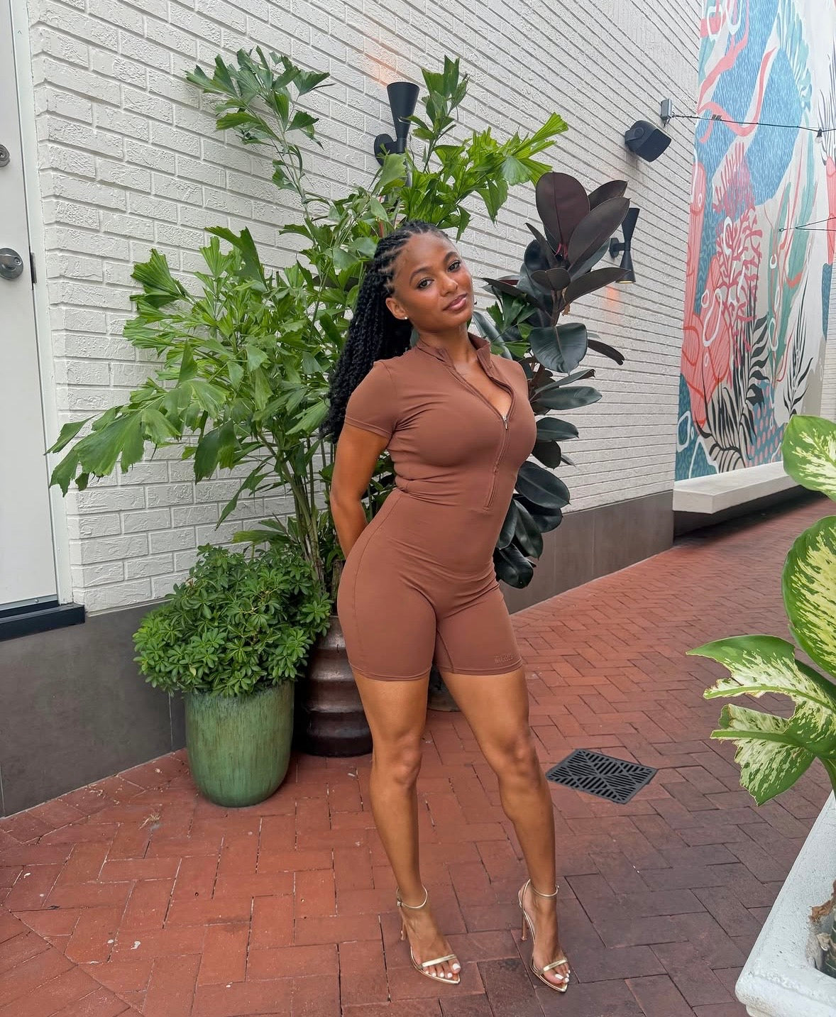 Brown fitted sculpting romper, scoop neckline and short sleeves