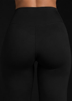 Dark flared pants with high-rise waistband and vertical seam details