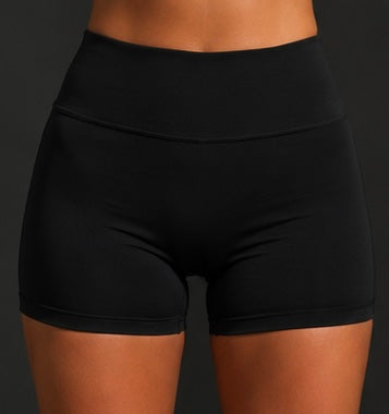 Black high-waist performance shorts with curved seam lines (front view close-up).