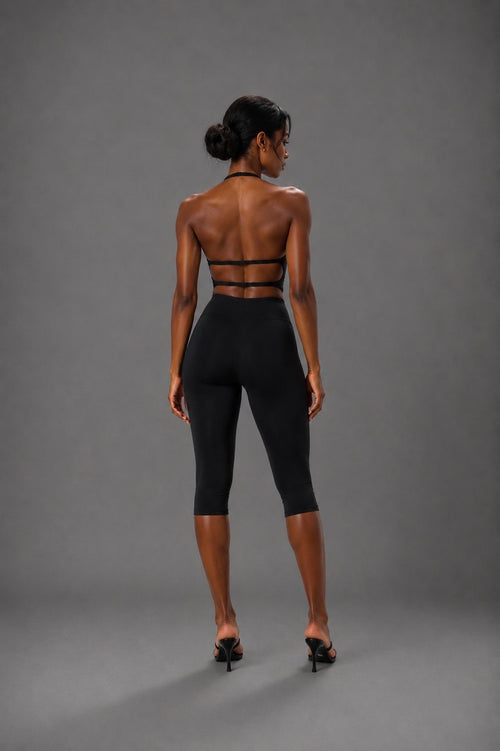 Black sports bra and capri leggings set with strappy back and wide waistband