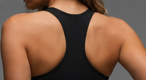 Black sports bra, racerback back design close-up