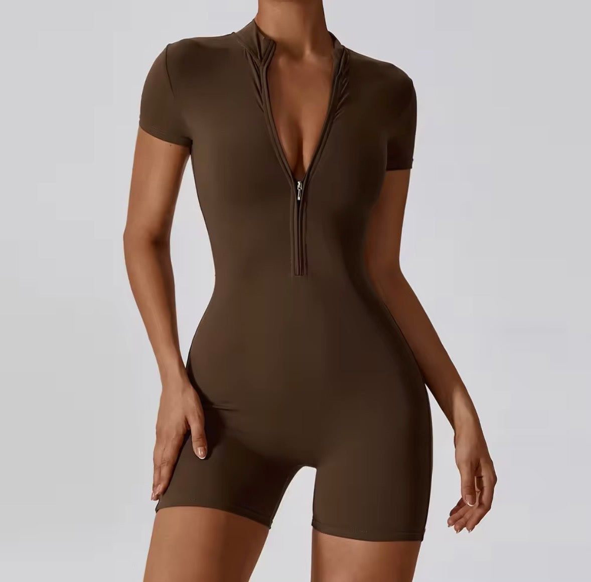 Brown fitted romper with deep V zip front and short sleeves, mid-thigh legs
