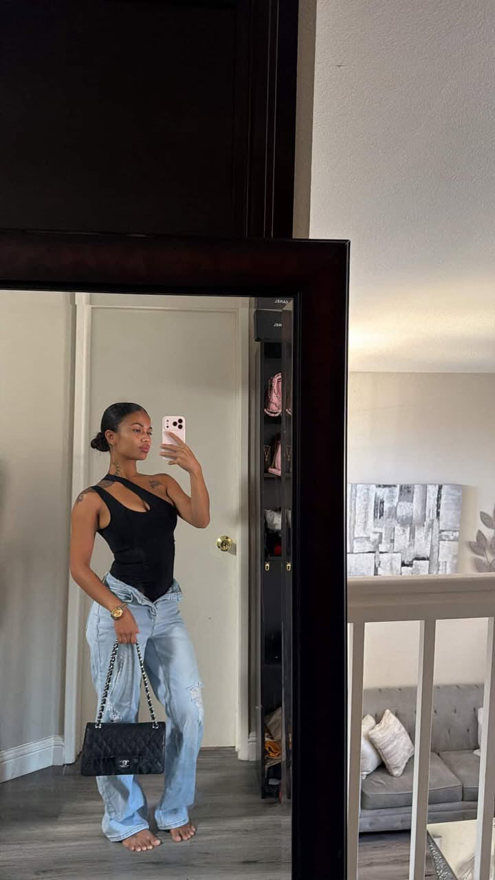 Dark seamless asymmetrical one-shoulder bodysuit, full-length mirror view