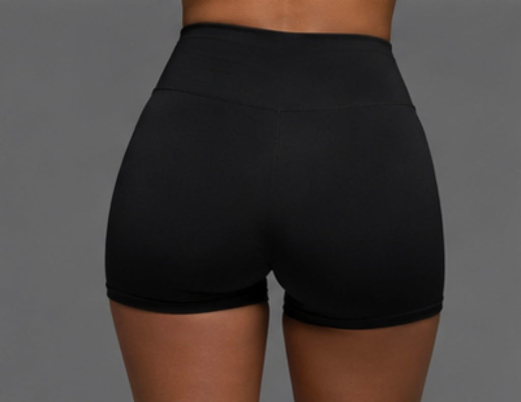 Black high-waist athletic shorts, smooth waistband close-up