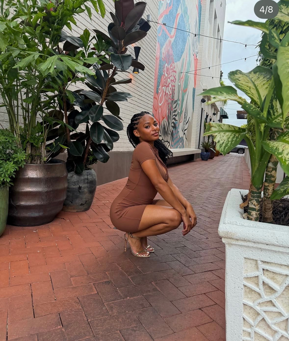 Brown sculpting romper with short sleeves and fitted shorts