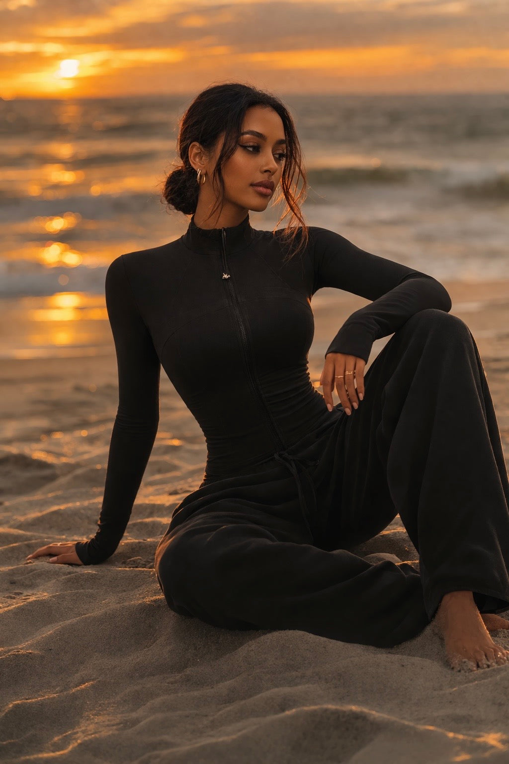 Black zip-up sculpting jacket with high neck and long sleeves