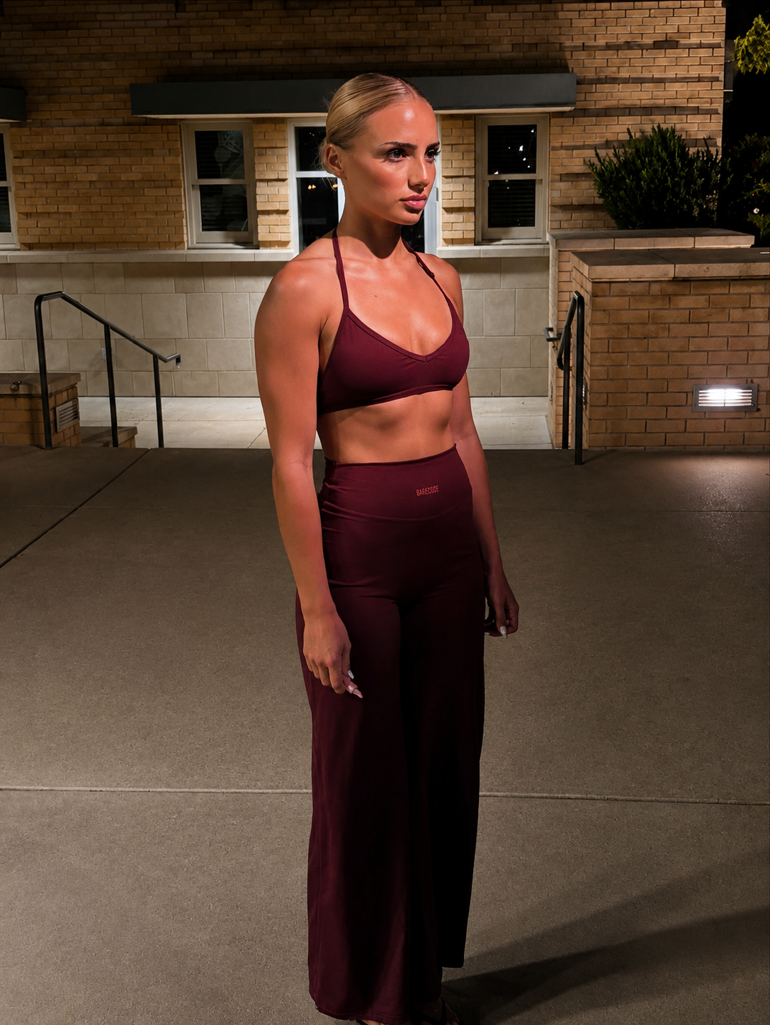 Plum flared pants and matching bralette set with spaghetti straps, fitted waist
