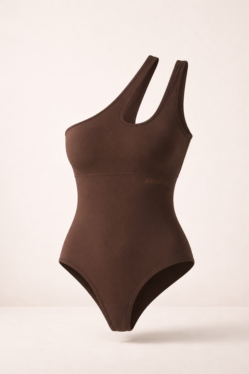 Asymmetrical one-shoulder sculpting bodysuit in cocoa brown, with side cutout.