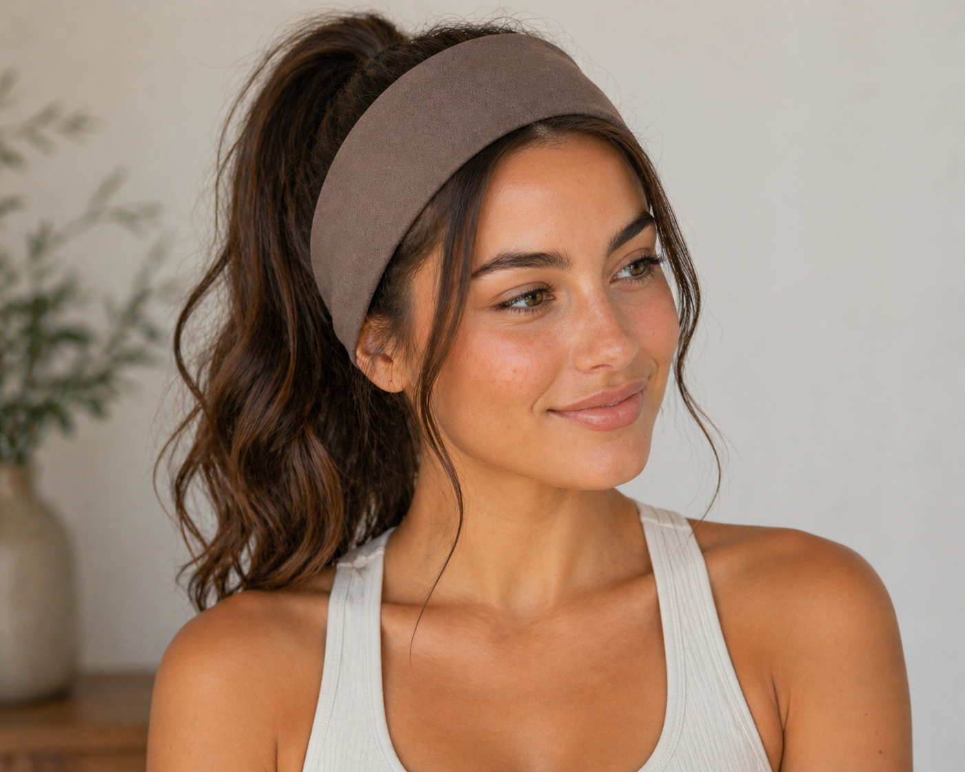 Wide taupe-brown headband worn across forehead