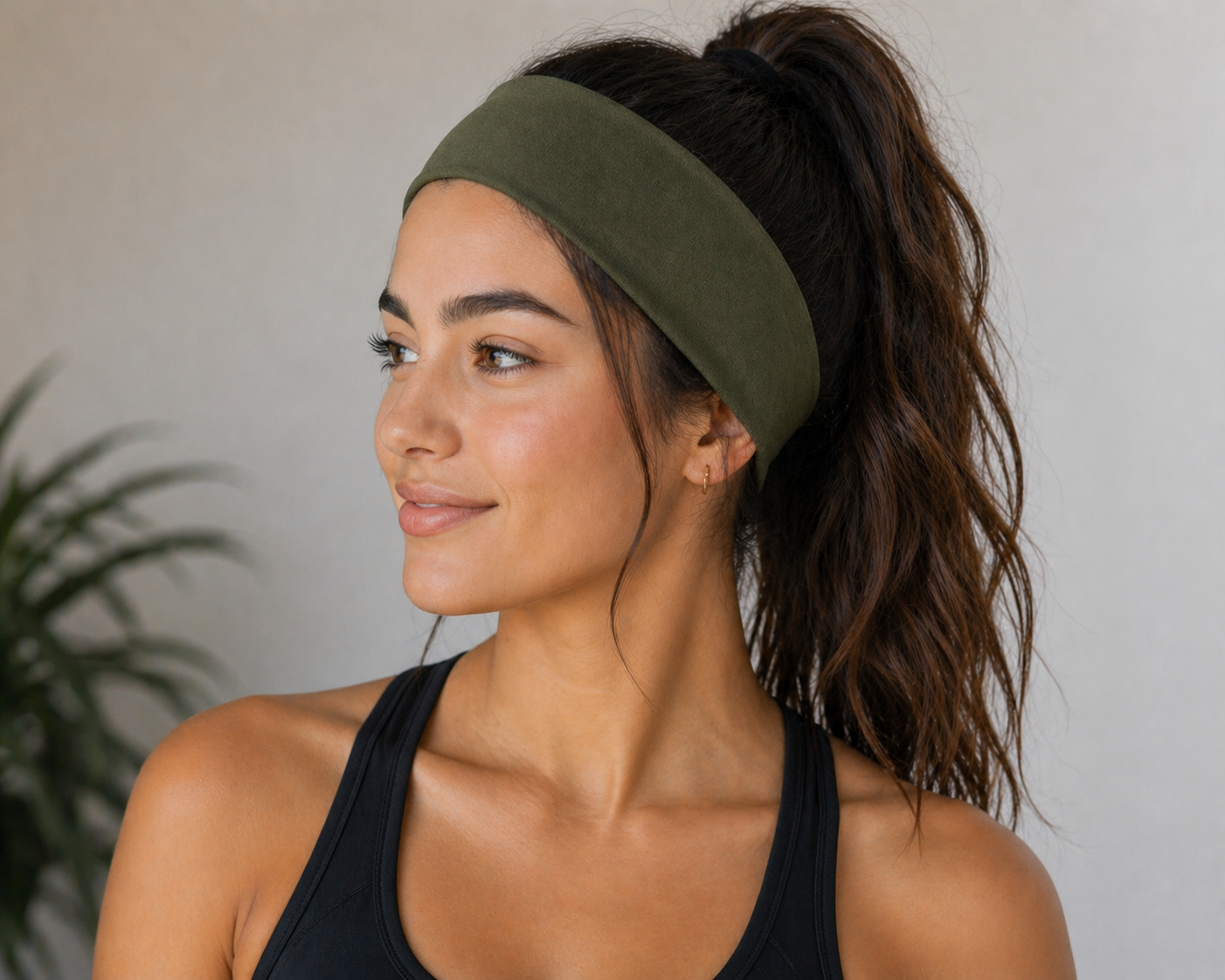 Wide polyester headband in army green worn on model