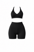 Black sports bra and high-waist shorts set, front view flat lay