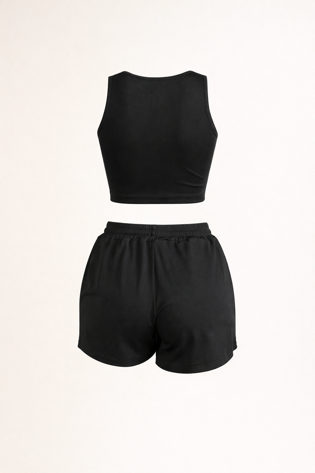 Black two-piece loungewear set with racerback crop top and elastic drawstring shorts